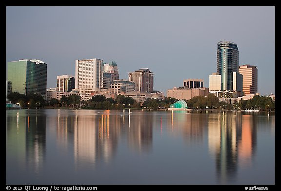Skyline at dawn from lake Eola. Orlando, Florida, USA