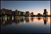 Orlando skyline at sunset reflected in lake Eola. Orlando, Florida, USA ( color)