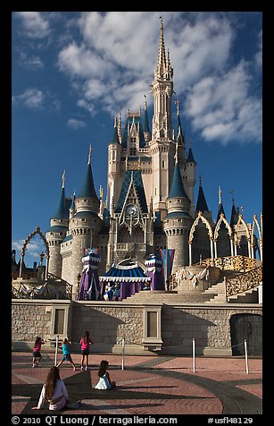 Girls in front of Cindarella castle, Walt Disney World. Orlando, Florida, USA (color)