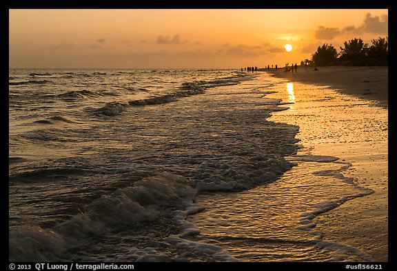 Beach with people in the distance at sunset, Sanibel Island. Florida, USA (color)