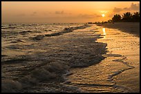 Beach with people in the distance at sunset, Sanibel Island. Florida, USA ( color)
