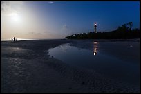 Lighthouse beach with family in distance and moonlight, Sanibel Island. Florida, USA ( color)