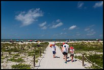 Family walking out to Bowman Beach, Sanibel Island. Florida, USA ( color)