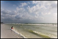 Woman sitting in water, Fort De Soto beach. Florida, USA (color)
