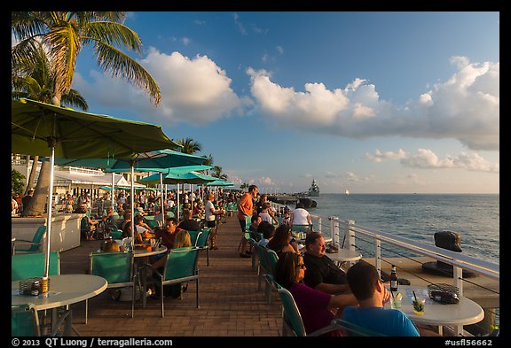 Waiting for sunset with drink in hand on Mallory Square. Key West, Florida, USA (color)