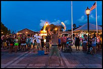 Street entertainer and spectators. Key West, Florida, USA (color)