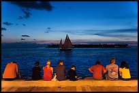 Tourists watching ocean after sunset, Mallory Square. Key West, Florida, USA (color)