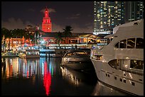 Yachts, Bayside Marketplace harbor and Freedom Tower illuminated at night, Miami. Florida, USA ( color)