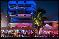 Restaurant tables and Art Deco buildings at night, Miami Beach. Florida, USA ( color)