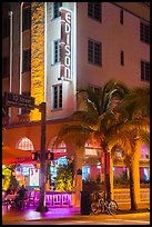 Corner street with Edison hotel, bicycle and palm tree at night, Miami Beach. Florida, USA ( color)