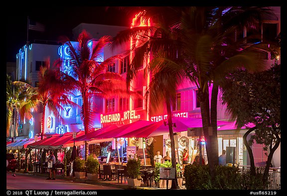Art Deco hotels and restaurants with facades lit in bright colors, Miami Beach. Florida, USA