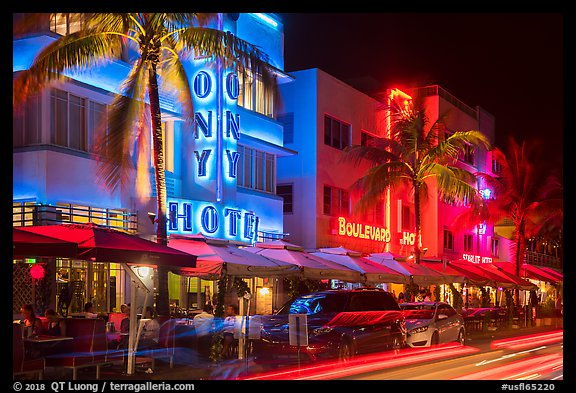 Art Deco hotels colorfully illuminated and traffic light trails, South Beach, Miami Beach. Florida, USA