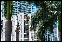 Palm tree leaves, statue, and high rises, Brickell, Miami. Florida, USA ( color)