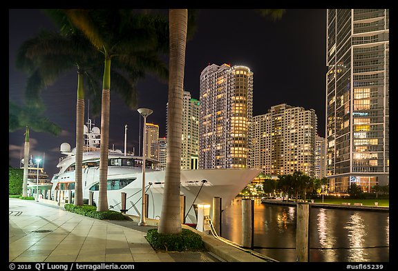 Large yacht, Miami River, and Brickell Key at night, Miami. Florida, USA