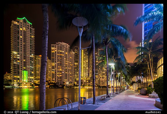 Miami Riverwalk and Miami River, Brickell district, night, Miami. Florida, USA