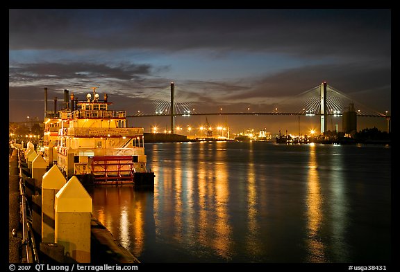 Riverboat and Savannah Bridge at dusk. Savannah, Georgia, USA