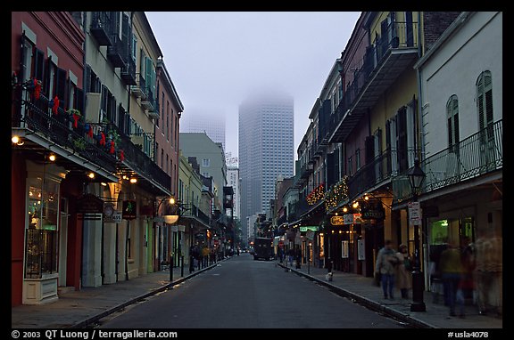 Bourbon street and the new town in the fog, French Quarter. New Orleans, Louisiana, USA (color)