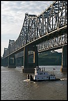 Tugboat under brige on Mississippi River. Natchez, Mississippi, USA