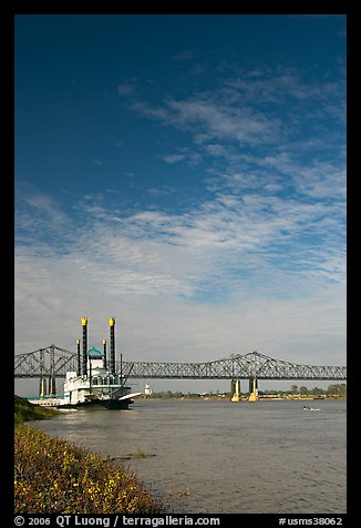 Mississippi River, paddle riverboat, and bridge. Natchez, Mississippi, USA (color)