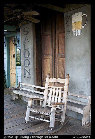 Rocking chair on saloon porch, Natchez under-the-hill. Natchez, Mississippi, USA (color)