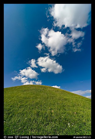 Rounded hill and clouds,  Emerald Mound. Natchez Trace Parkway, Mississippi, USA