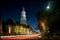 St Michael Episcopal Church and street with traffic at night. Charleston, South Carolina, USA