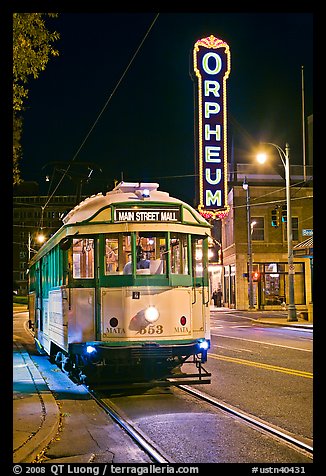 Trolley and Orpheum theater sign by night. Memphis, Tennessee, USA (color)