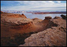 Sandstone swirls and Lake Powell, Glen Canyon National Recreation Area, Arizona. USA