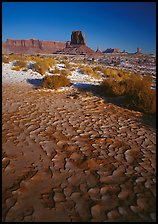 Clay pattern on floor and buttes in winter. Monument Valley Tribal Park, Navajo Nation, Arizona and Utah, USA
