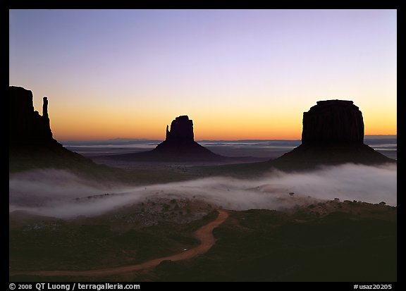 Mittens and fog, sunrise. Monument Valley Tribal Park, Navajo Nation, Arizona and Utah, USA