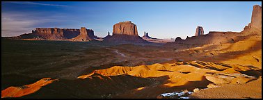 Monument Valley late afternoon scenery with shadows. Monument Valley Tribal Park, Navajo Nation, Arizona and Utah, USA (Panoramic color)