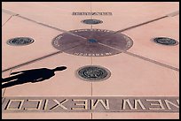 Shadow and state seals. Four Corners Monument, Arizona, USA ( color)