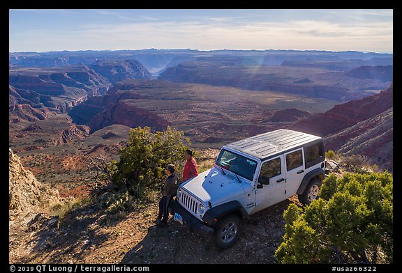 Jeep and visitors on rim edge of Grand Canyon. Grand Canyon-Parashant National Monument, Arizona, USA (color)