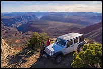 Jeep and visitors on rim edge of Grand Canyon. Grand Canyon-Parashant National Monument, Arizona, USA ( color)