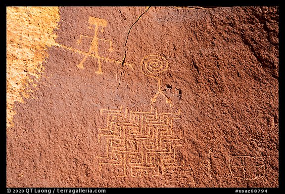 Petroglyph depicting person wearing earrings with ladder-like insect and maze. Vermilion Cliffs National Monument, Arizona, USA (color)