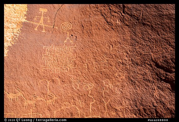 Petroglyph panel with anthropomorphic, zoomorphic, and abstract designs. Vermilion Cliffs National Monument, Arizona, USA
