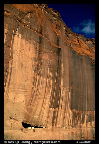 White House Ancestral Pueblan ruins and wall with desert varnish and corner of sky. Canyon de Chelly  National Monument, Arizona, USA