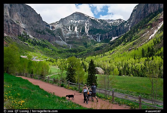 Family hiking on trail towards Bridalveil Falls in the spring. Telluride, Colorado, USA