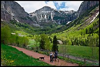 Family hiking on trail towards Bridalveil Falls in the spring. Telluride, Colorado, USA ( color)