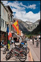 Mountain bikes parked on main street sidewalk. Telluride, Colorado, USA (color)