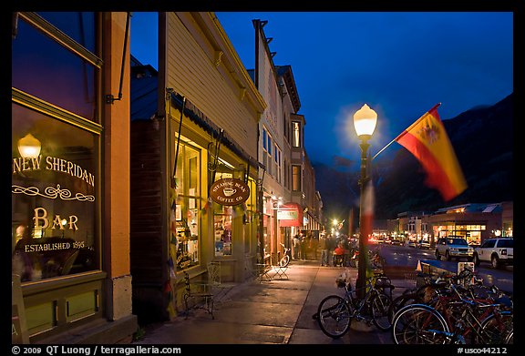 Street with parked bicycles and lamp by night. Telluride, Colorado, USA