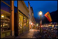 Street with parked bicycles and lamp by night. Telluride, Colorado, USA ( color)