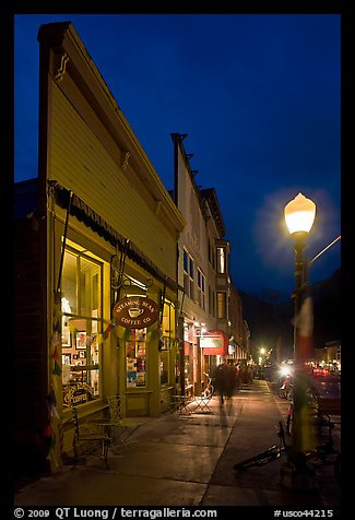 Coffee shop and sidewalk by night. Telluride, Colorado, USA (color)