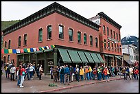 Festival attendees line up on sidewalk. Telluride, Colorado, USA
