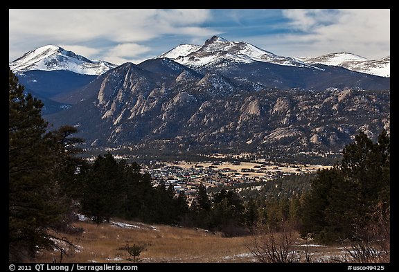 View of town nested below Rocky Mountains, Estes Park. Colorado, USA (color)