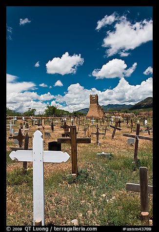 Wooden crosses and old adobe church. Taos, New Mexico, USA (color)