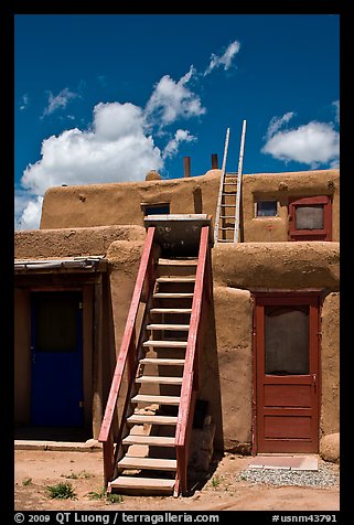 Ladder used to access upper floor of pueblo. Taos, New Mexico, USA