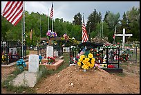 Headstones, tombs and american flags. Taos, New Mexico, USA (color)