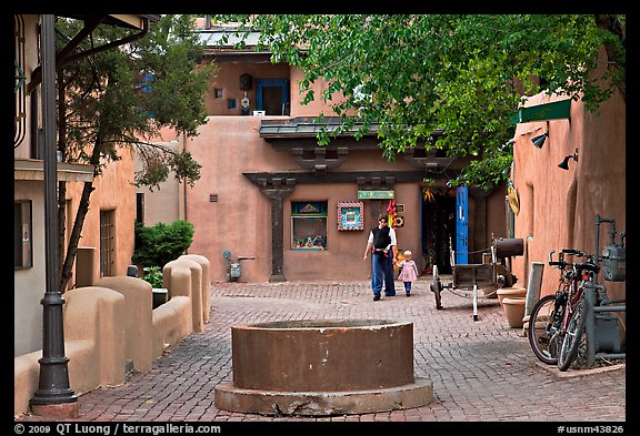 Pedestrian alley with woman and child. Taos, New Mexico, USA