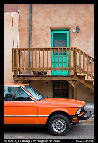 Car and adobe house detail. Taos, New Mexico, USA